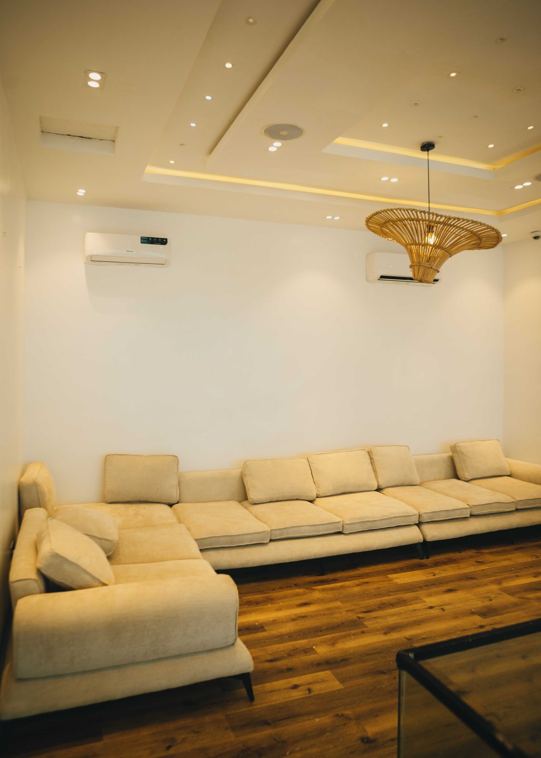 A long low sectional sofa running the length of the living room
